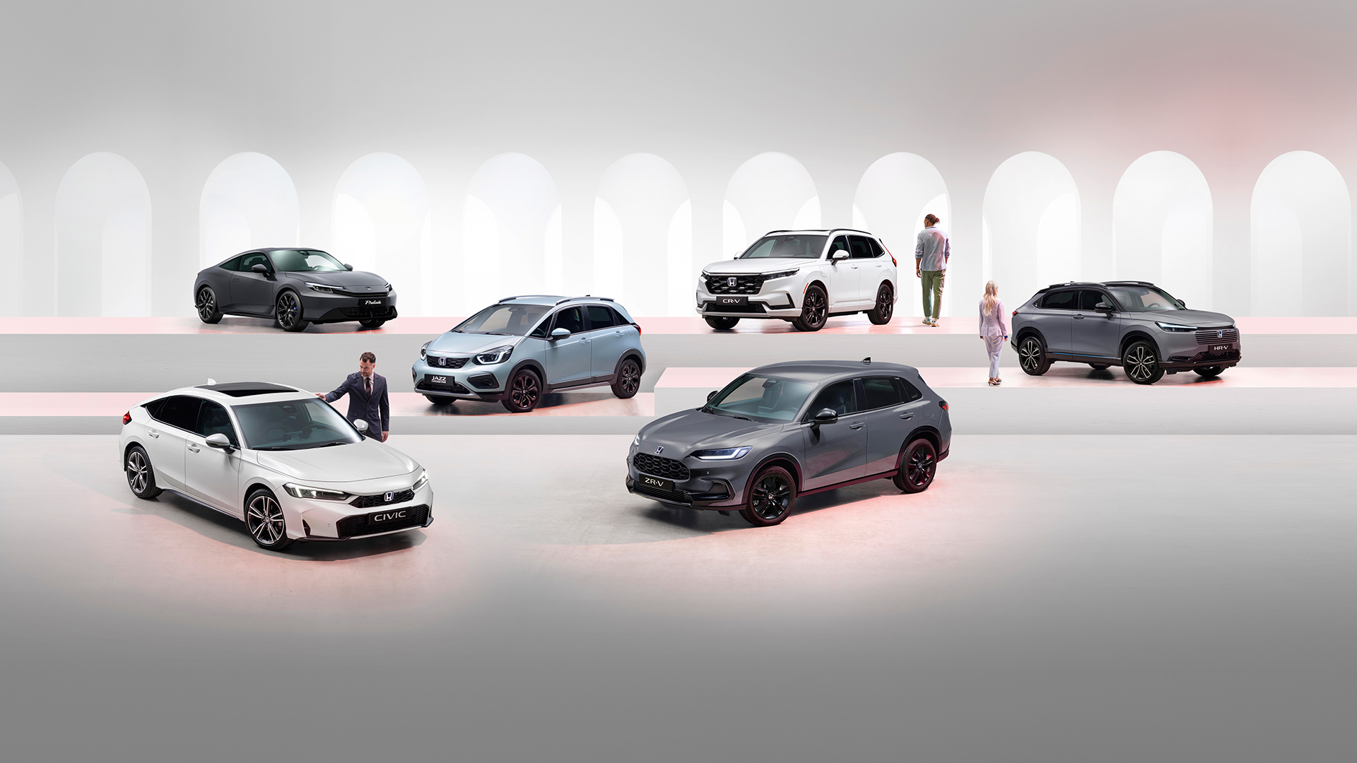 Honda electrified range including a grey Prelude, white CR-V, grey HR-V, light blue Jazz, grey ZR-V, and white Civic.
